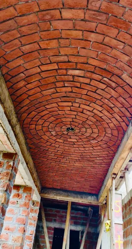 Corridor with curved brick ceiling by Rohtak Domes