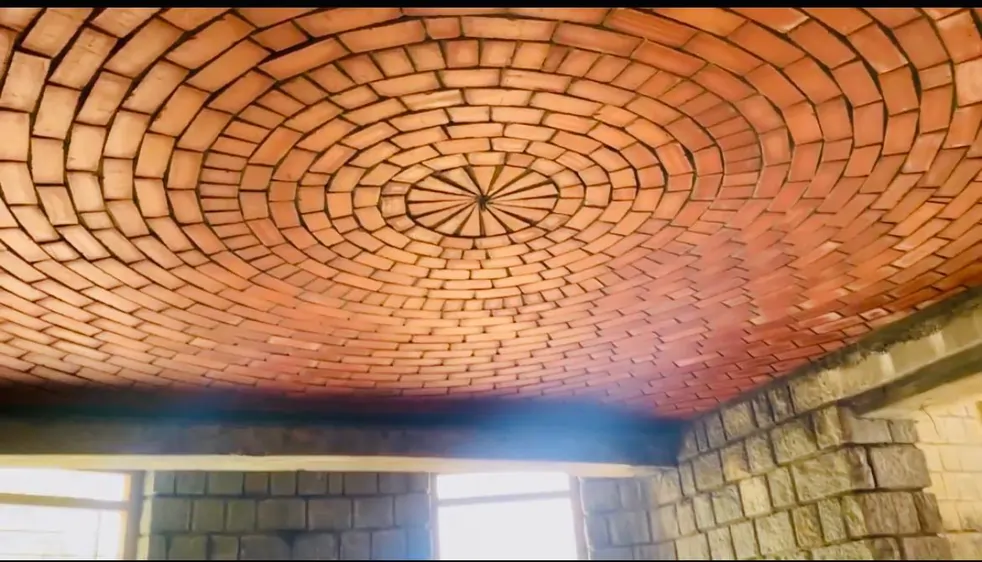 Circular brick dome ceiling with spiral pattern by Rohtak Domes